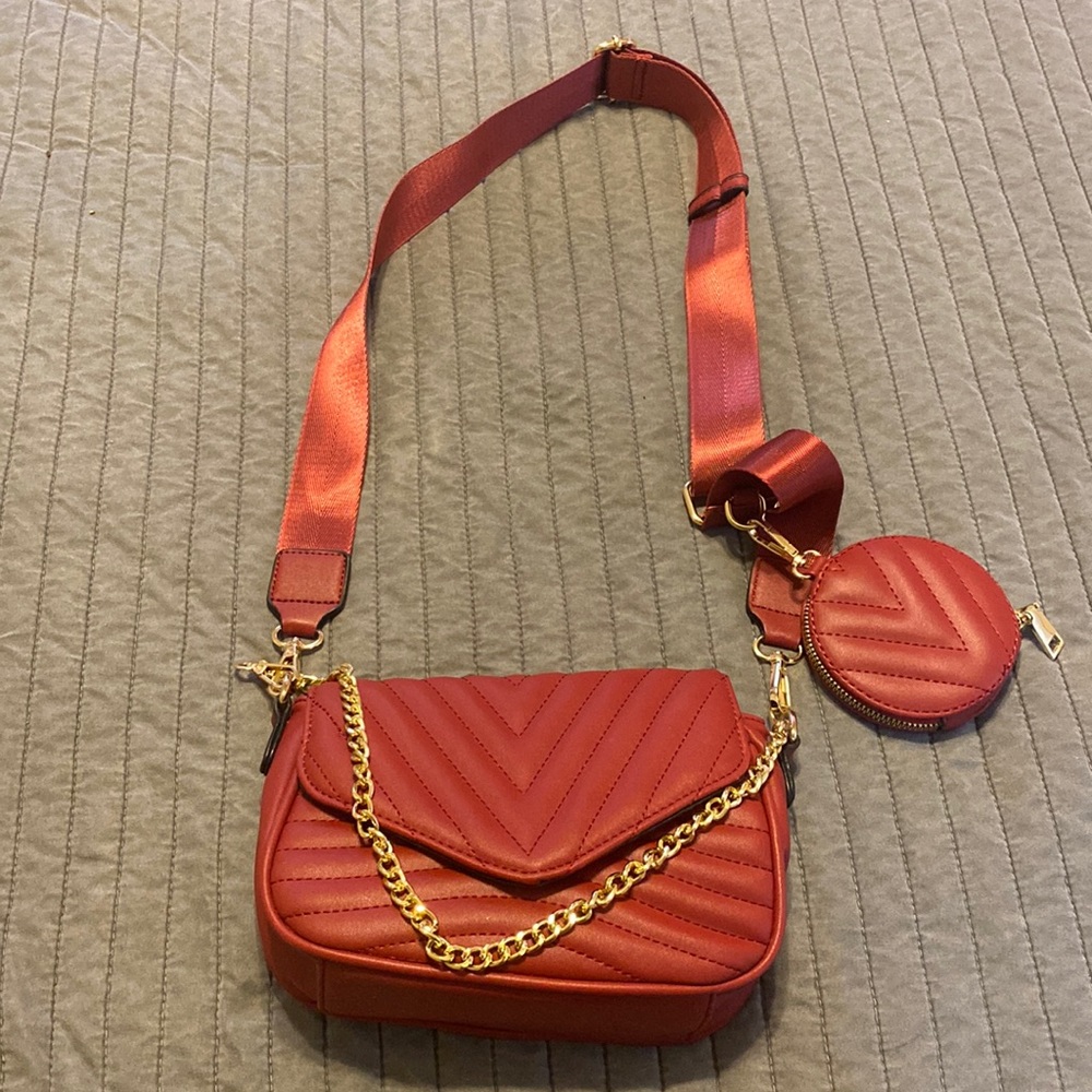 quilted red crossbody bag (no designer name)